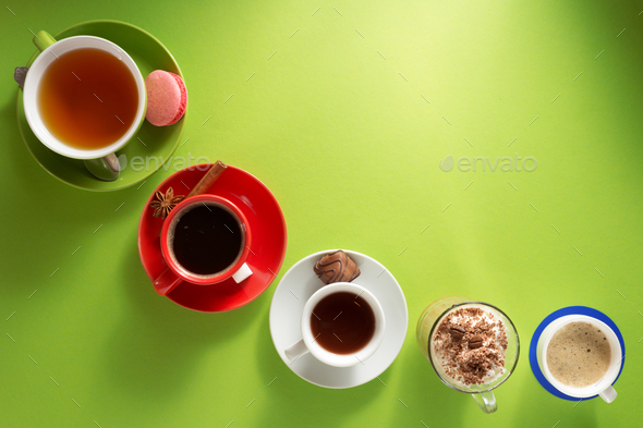 cup of coffee, tea and cacao at colorful background Stock Photo by seregam
