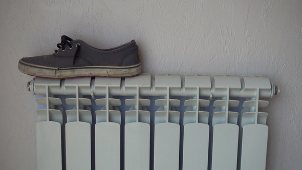 Heating Radiator. Shoes, Keds, Drying After Rain