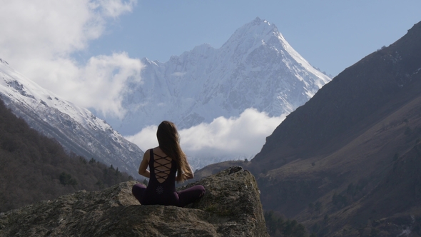Meditation in Front of Snow-capped Peaks
