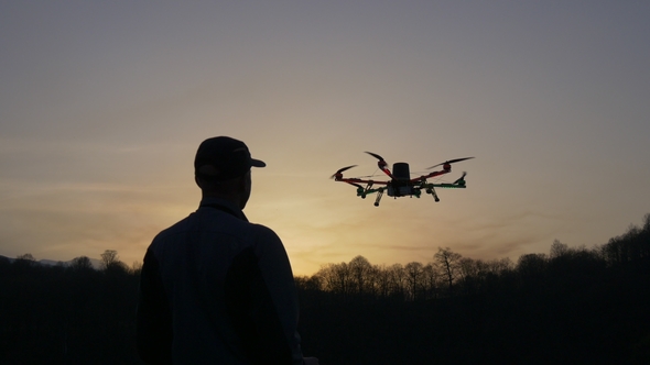 Man Operating a Drone