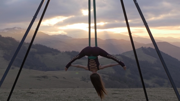 Woman Doing Aerial Fly Yoga Exercising Outdoor