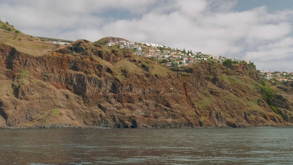 Madeira Island with Its Cliffy Shore, White Houses and Buildings, Roads and Trestles