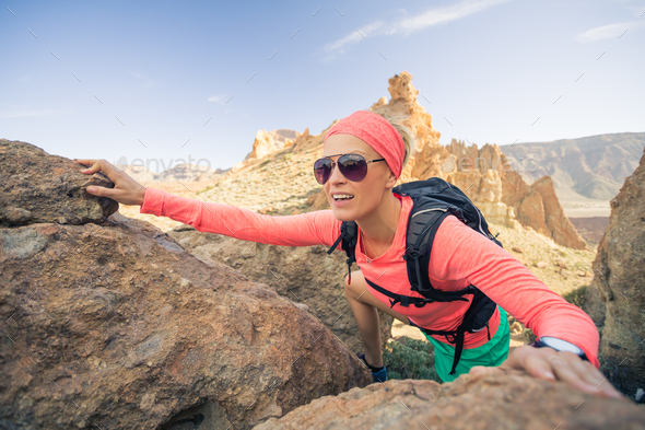 Woman hiker reached mountain top, backpacker adventure - Stock Photo - Images
