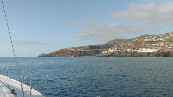 View of Madeira Island with Its Cliffy Shore, White Houses and Buildings, Roads and Trestles
