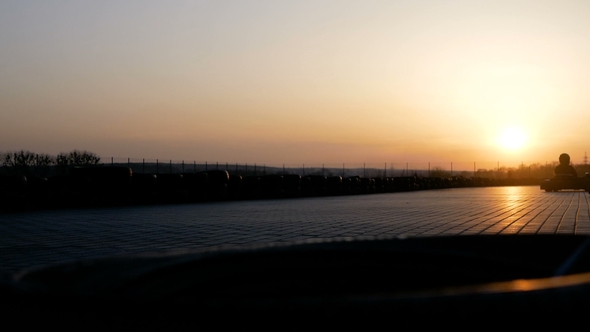 Race on Karting at Sunset. Guys in Helmets Compete for Speed. Cars Are Driving Forward at High Speed