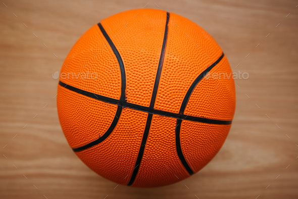 Basketball ball on court floor
