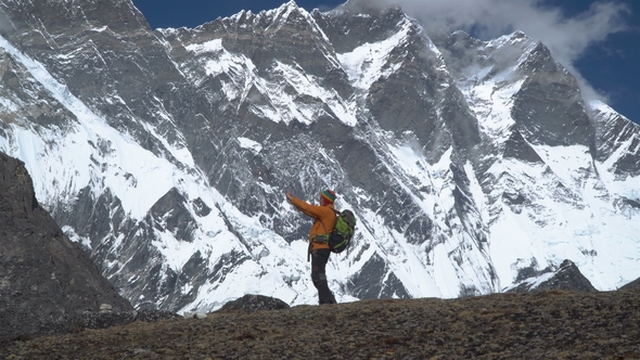 Tourist in the Himalayas Makes a Photo alt