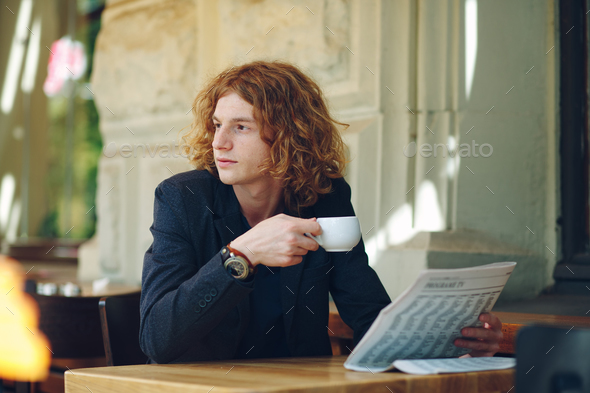 Hipster man drinking coffee while thinking Stock Photo by arthurhidden