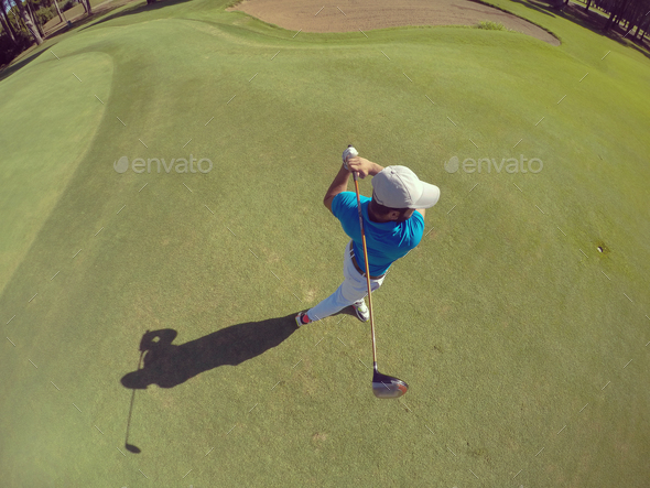 top view of golf player hitting shot - Stock Photo - Images