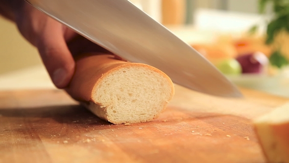 Slicing Baguette on a Cutting Board alt