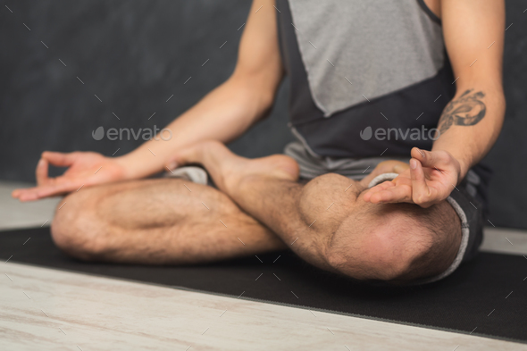 Young man practicing yoga, relax meditation pose Stock Photo by