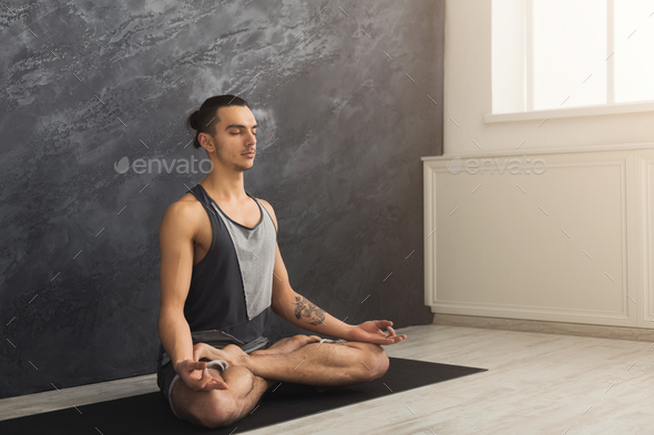 Young man practicing yoga, relax meditation pose Stock Photo by Milkosx