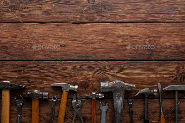 Border of repair tools on wood background with copy space Stock Photo by Milkosx