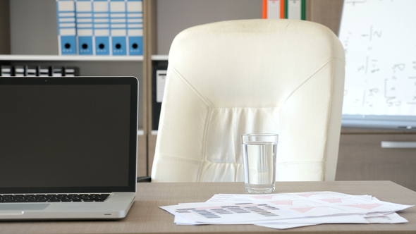 Empty Modern Office with a Laptop on the Desk alt