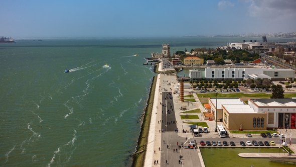 Belem Tower and Tourists at the Riverside of Tejo River,