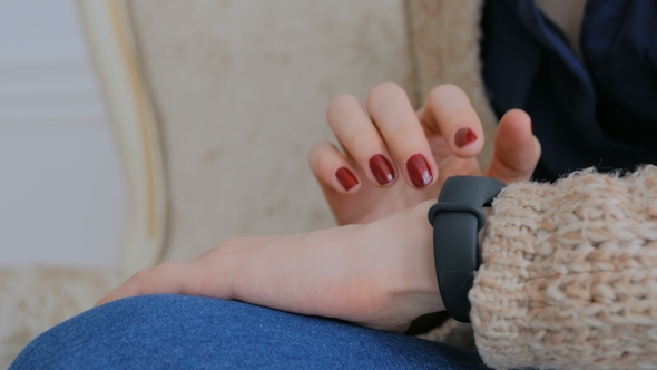 Young Woman Using Wearable Smart Fitness Tracker