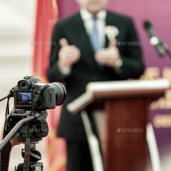 Businessman during press conference Stock Photo by microgen | PhotoDune