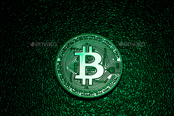 A Coin With Bitcoin Logo In A Green Lighting Stock Photo By Photocreo