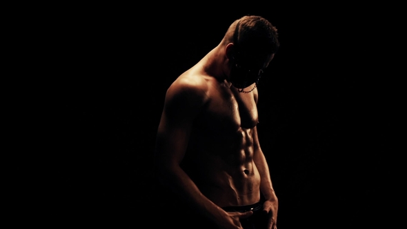 Man in Mask on Black Background