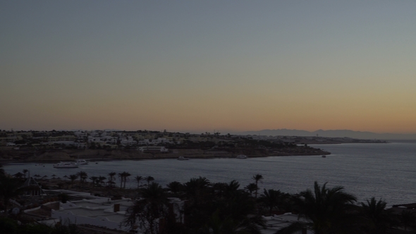 Rising Sun over the Sea and Desert Mountains