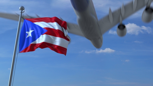 Commercial Airplane Flying Above Waving Flag of Puerto Rico, Motion ...