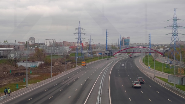 View From Bridge of Large City Road with Cars Moving on It