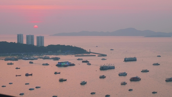 Up View of Speed Boats and Platforms with Night Clubs During Picturesque Sunset