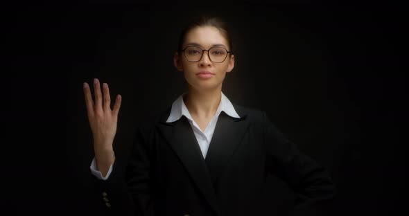 Business Woman with Glasses with a Serious Face Shows Four Finger