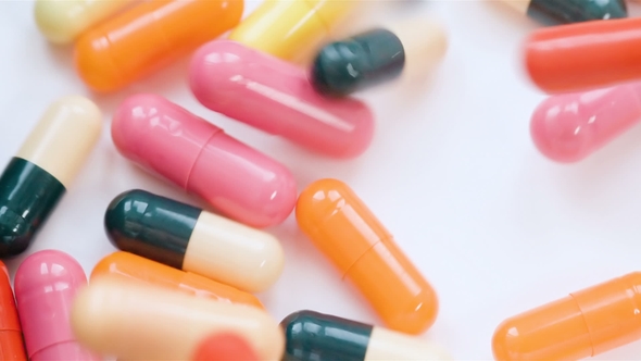 Pills and Tablet Closeup. Medicinal drugs. Medication Capsule White Background. Medicament Vitamin. alt