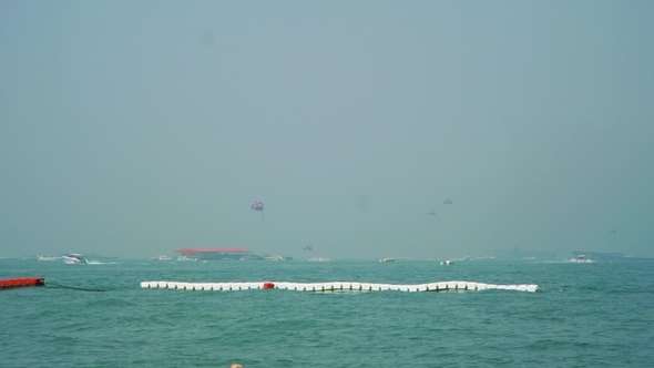 View of Busy Sky and Sea in Pattaya Beach and Buoys Separating Zone of Bathing
