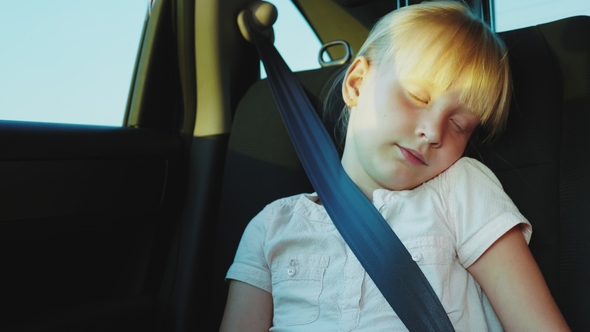 Blonde Girl 6 Years Dozing in the Back Seat of the Car. Traveling in a ...