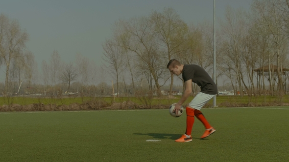 Handsome Soccer Player Taking a Penalty Kick alt