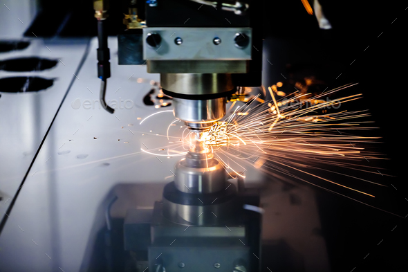 CNC Laser cutting of metal, modern industrial technology. Stock Photo by cookelma