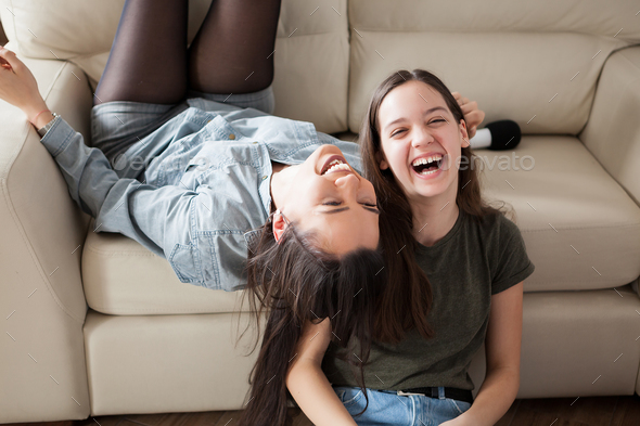 Two sisters having fun at home Stock Photo by DC_Studio | PhotoDune