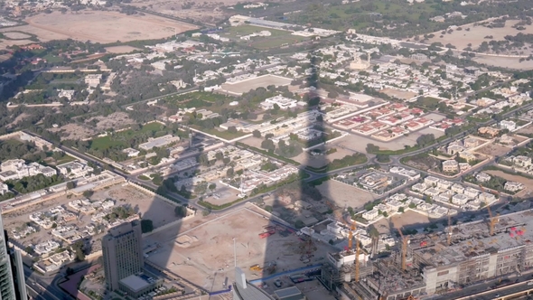 Shadow of Burj Khalifa Tower on a Districts of Dubai Afternoon