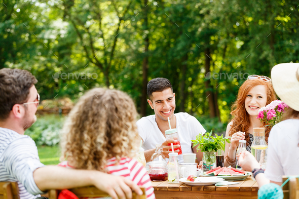Young people laughing and eating Stock Photo by bialasiewicz | PhotoDune