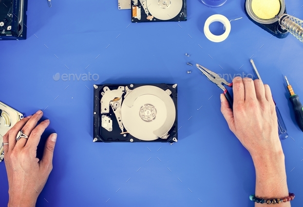 Hands holding tool fixing HDD at electronics repair shop Stock Photo by Rawpixel