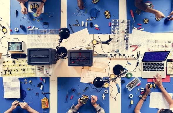Aerial view of electronics technicians team working