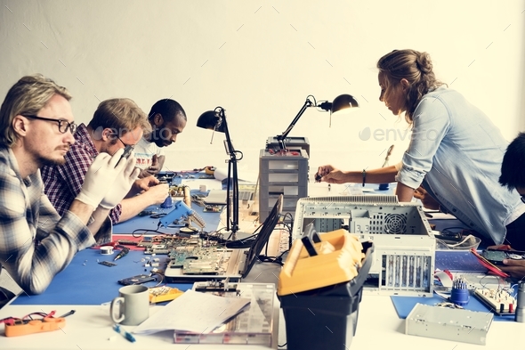 Electronics technicians team working on computer parts Stock Photo by Rawpixel