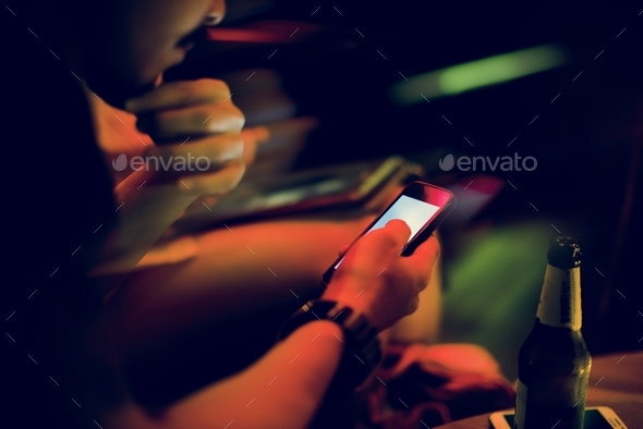 Closeup of people using mobile phone night time Stock Photo by Rawpixel