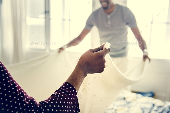 Black couple changing bed sheet together Stock Photo by Rawpixel | PhotoDune