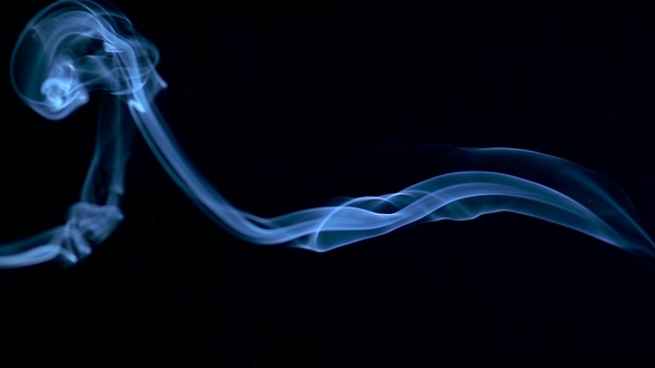 Silky Smoke Slowly Floating Through Space Against Black Background alt