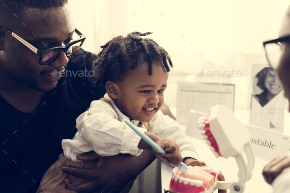 Father and son meeting up with a dentist Stock Photo by Rawpixel | PhotoDune
