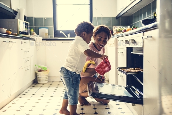 Black kid helping mom baking cookies Stock Photo by Rawpixel | PhotoDune