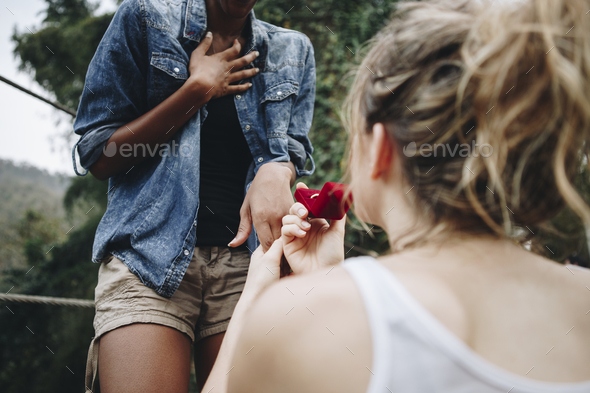 Woman proposing to her happy girlfriend outdoors love and marriage concept Stock Photo by Rawpixel