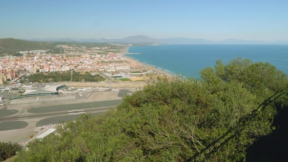 Top View of Landing Strip of Gibraltar Airport and Faraway View of Spanish Coastline