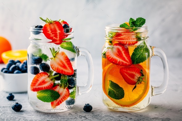 Infused Detox Water With Blueberry Strawberry Orange And Mint Stock Photo By Nblxer