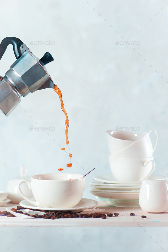 Coffee Pot Serving Coffee In A White Cup Stock Photo, Picture and Royalty  Free Image. Image 148218111.