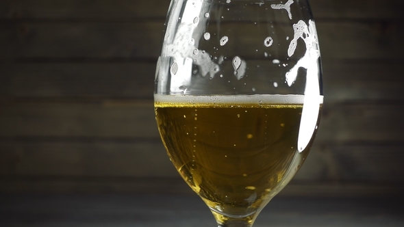 Pouring Light Beer Into Glass
