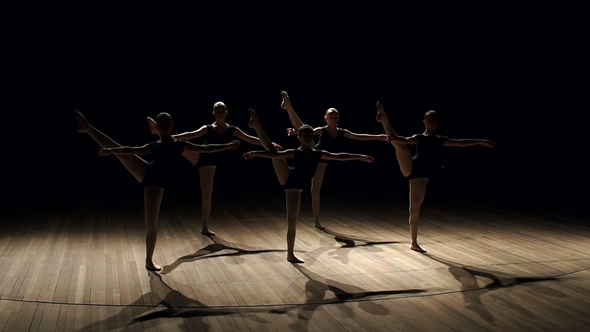 Young Teen Girls Perform Ballet on Stage in Dark. alt